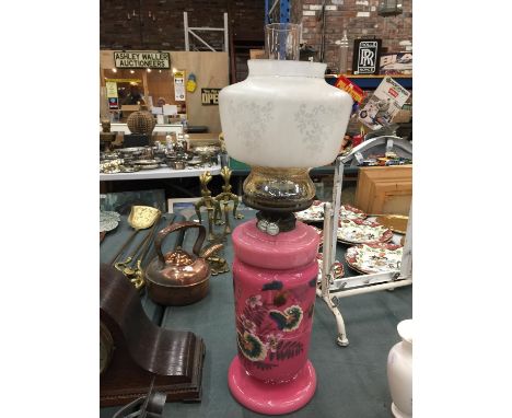 A LARGE PINK AND FLORAL OIL LAMP WITH SHADE AND CHIMNEY A/F APPROX 60CM HEIGHT 