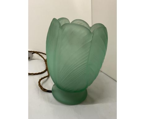 A GREEN GLASS TABLE LAMP IN THE FORM OF AN OPENING FLOWER 