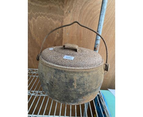 A VINTAGE CAST IRON LIDDED COOKING POT 