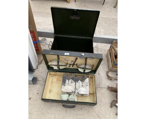 A METAL STORAGE CHEST AND A PICNIC HAMPER 
