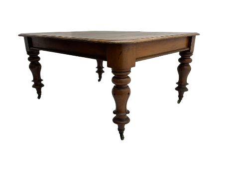 Mid-19th century mahogany dining table, rectangular top with moulded edge over banded frieze, raised on turned and lappet car