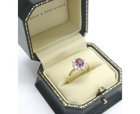 Boodles 18ct ruby and diamond cluster ring, the central emerald in a surround of ten round-brilliant cut diamonds, cluster 12
