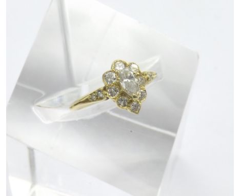 18ct yellow gold diamond cluster ring, the pear shaped diamond in a surround of round-brilliant cuts, clarity S/I, colour G/H