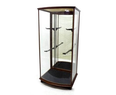 Good 19th century bow fronted display cabinet, the glazed front and sides enclosing a mirror backed interior, 62" high, 30" w