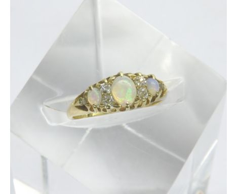 Attractive period 18ct opal and diamond claw set ring, with three oval opals interspersed with rose cut diamonds, 3.7gm, ring