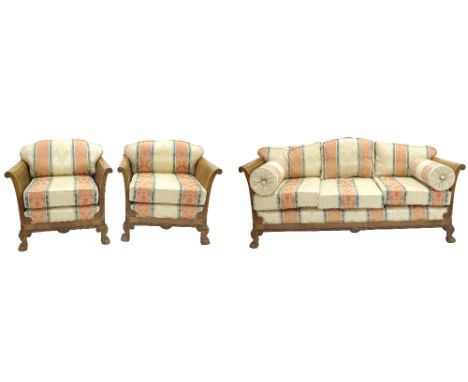 Three piece bergere walnut suite with striped damask upholstery, the sofa 72" long (at fault)