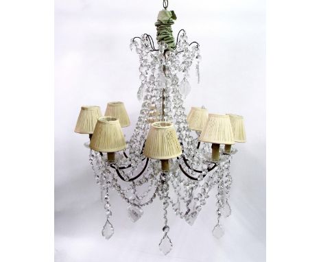 Venetian style six branch chandelier with various prismatic drops and ribbons