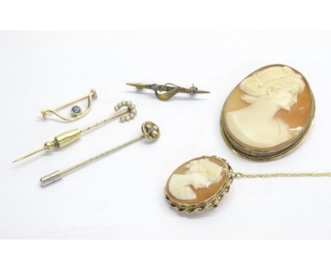 Small 9ct oval mounted cameo brooch with safety chain, 13mm x 24mm; larger silver-gilt mounted oval cameo brooch, two gem set