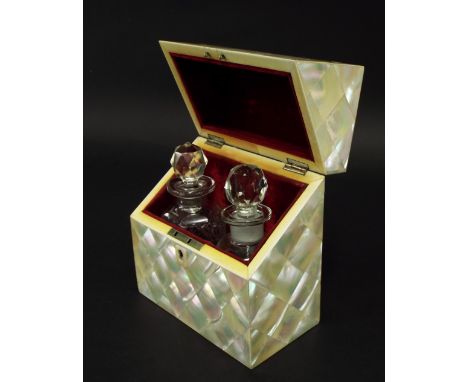 19th century mother of pearl casket, the hinged lid enclosing a red baize lined interior with two cut glass scent bottles wit