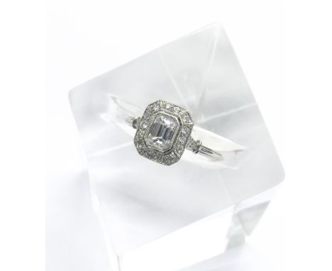 Good quality platinum emerald cut cluster ring, the centre stone 0.43ct approx, clarity VS, colour F/G, in a surround of roun