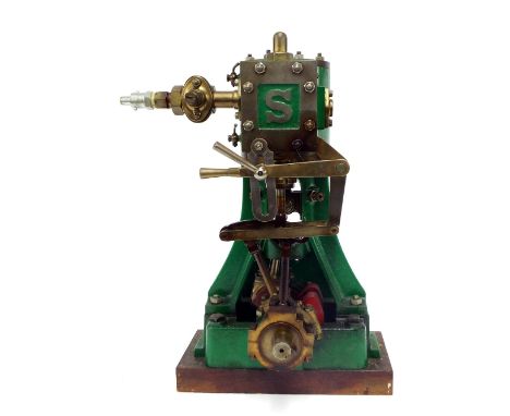 Impressive cast metal vertical live steam engine inscribed with the letter S, on a wooden plinth base, 14" high