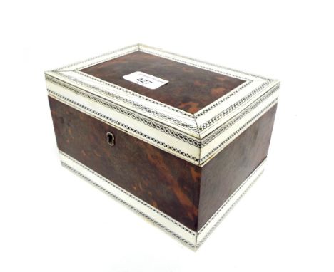 Vizagapatam, tortoiseshell and ivory tea caddy, the hinged lid with rope twist and chequer board borders enclosing a sectione