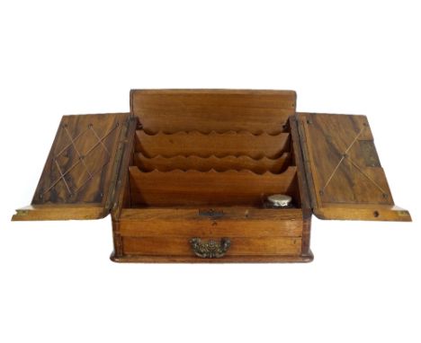 Late 19th century walnut writing slope, the twin doors enclosing a waterfall interior fitted with a glass inkwell over a sing