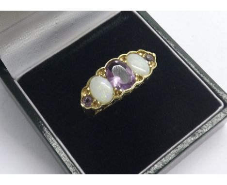 Large amethyst and opal claw set three stone 9ct yellow gold ring, 3.3gm, ring size R; boxed