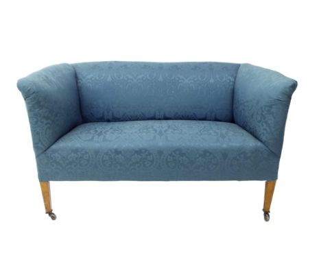 Early 20th century salon sofa with blue damask upholstery upon tapered wooden legs and ceramic castors, 55" wide