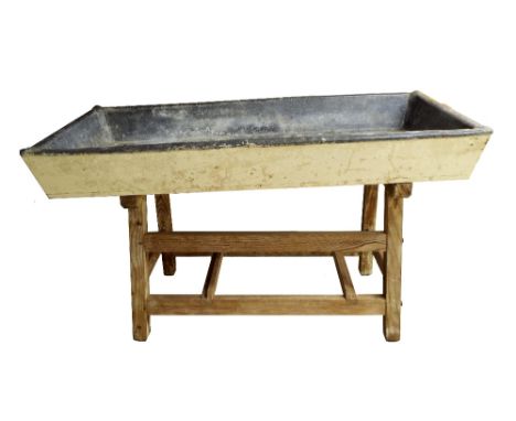 Large antique and decorative solid lead trough/planter upon a pitch pine stand, the trough 66" x 29.5", overall height 39" 