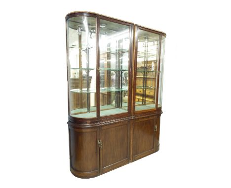 Good 19th century mahogany bow fronted display cabinet, the top fitted with twin opposing glazed doors and enclosing a shelve