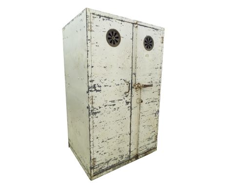 Vintage industrial - steel bread oven, the twin doors fitted with brass vents enclosing a fitted interior for shelving, upon 