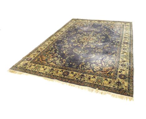 Large Keshan type carpet, decorated with floral sprays upon a blue ground, 140" x 97"