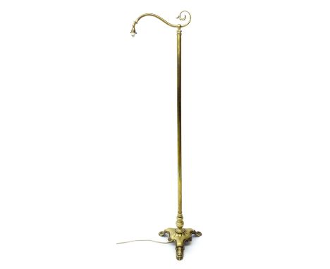 Late 19th/early 20th century cast brass standard lamp with scrolled arm, 65" high; together with a glass shade of the same pe