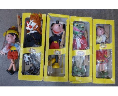 Four Pelham Puppets including Mickey Mouse, Frog and Gypsy, boxed and another Pelham Puppet (5)