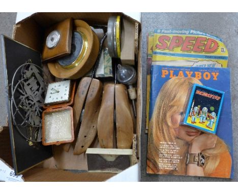 A boxed tin robot, barometers, travel clock and magazines including Playboy and Speed