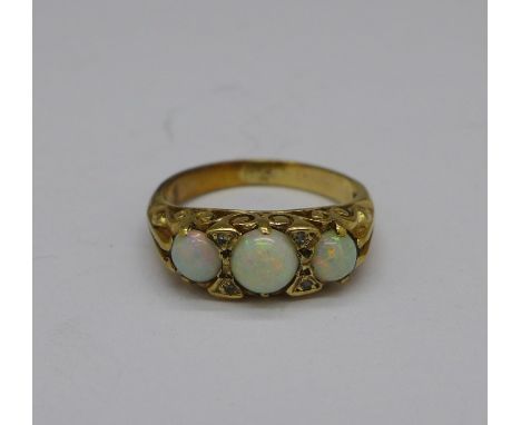 An 18ct gold, opal and diamond ring, hallmark worn, 2.4g, H