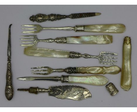 A Victorian silver and mother of pearl fork, a silver and mother of pearl crab pick, a pair of forks with mother of pearl han