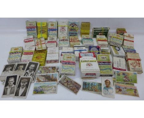 A collection of cigarette cards including Wills Regimental Standards and Cap Badges, Engineering Wonders, Cricketers 1928, Al