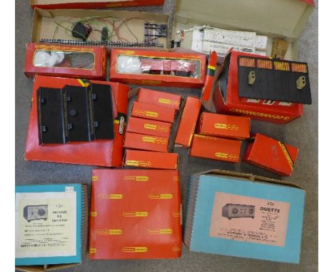 A collection of Hornby model rail including two control units, R001 Station set, R146 Engine Shed, R582 Ticket office, R400 S