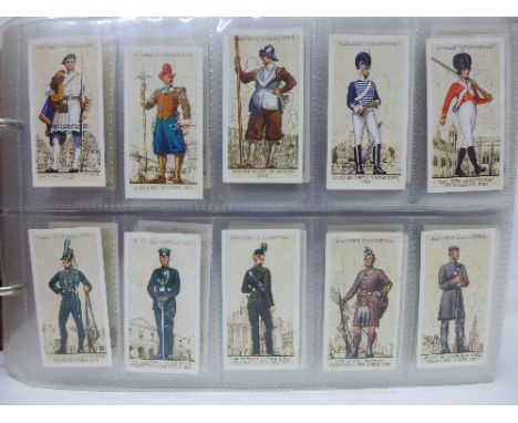 An album of cigarette cards; John Player Uniforms of The Territorial Army x2, Cricketers 1934, Modern Naval Craft, Players Pa