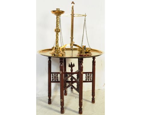 A collection of brass to include scales, charger with Binares folding base, spiral candlestick and other items.&nbsp;