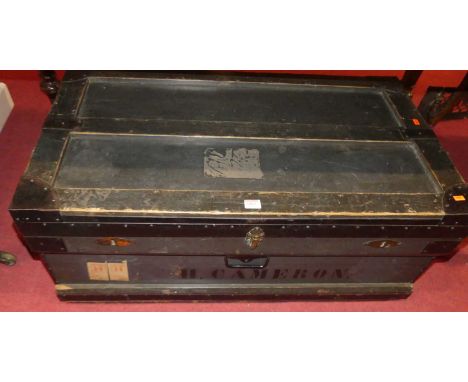 An early 20th century black painted and iron bound hinge top travel trunk, width 92cm