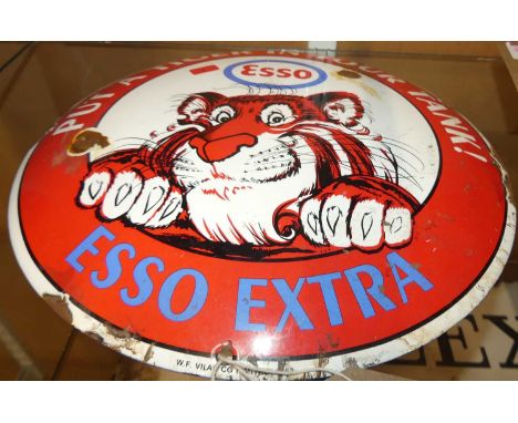 An enamel advertising sign for Esso Extra, dia. 29cmReproduction. 