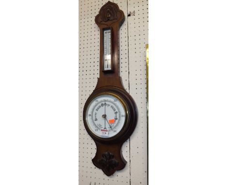 A mid-20th century walnut two-dial aneroid wheel barometerVery good condition. One small indentation top left. Looks to be wo
