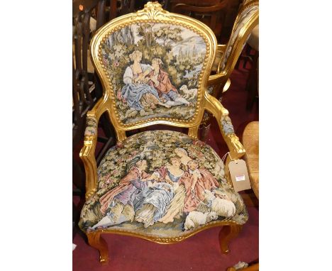 A pair of contemporary French gilt painted and needlework tapestry upholstered fauteuil, in the Louis XV style, w.57cm