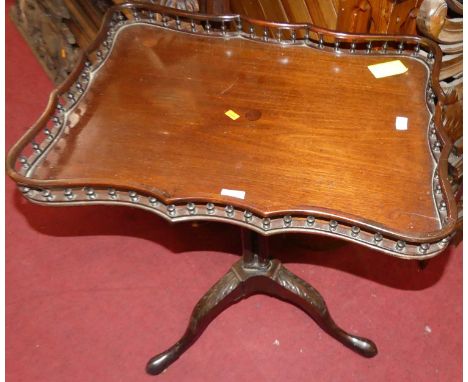 A 19th century mahogany shaped and galleried tilt top pedestal tripod table, width 59cm