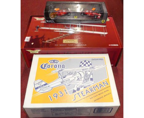 A Corgi Aviation Archive 1:32 scale model of the Wright Flyer; together with a Hot Wheels Ferrari racing set and a Corona Ert