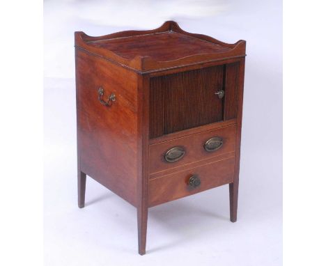 A George III mahogany tambour fronted night commode, having a full gallery top and tambour over a deep base drawer, w.50cm, d