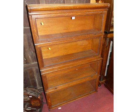 A 1930s Globe Wernicke oak four-tier stacking bookcase, width 86.5cm