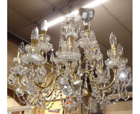 A good quality contemporary cut crystal glass and polished brass twelve-light hanging chandelier, approx drop 60cm 