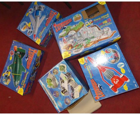 A collection of Thunderbirds Bandai and Carlton electronic play sets to include Thunderbird 3