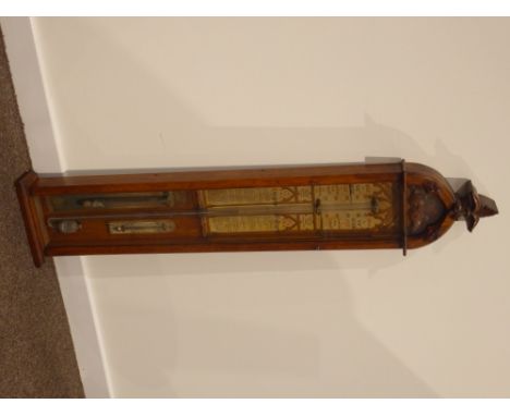 Admiral Fitzroy's Barometer with printed register in arched oak case with leaf carved finial, 117cms high.    Condition Repor