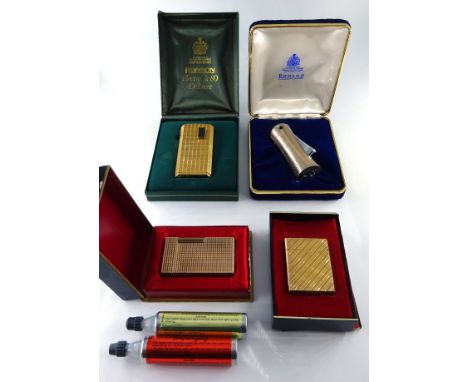 Dupont gilt metal lighter, boxed and with instructions another Dupont gilt metal lighter, boxed and two Ronson lighters.    C