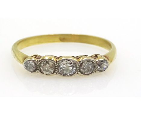 18ct Gold Ring with five diamonds in a rubover setting, unmarked but tests as 18ct.    Condition Report & Further Details  Ri
