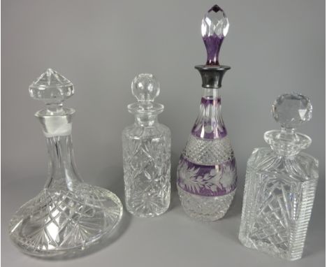 A hobnail cut and amethyst glass Decanter with silver collar, a Webb Corbett cylindrical decanter and two others.    Conditio