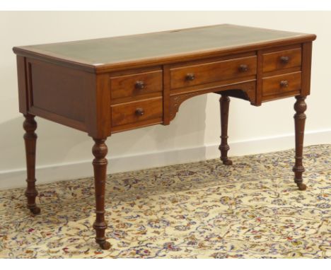 Late Victorian mahogany kneehole desk, inset leather top, five drawers, turned supports with ceramic castors, W120cm, H73cm, 