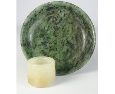 White and russet jade thumb ring with engraved decoration and a spinach jade shallow dish with Qianlong four character mark 1