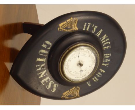 Aneroid Barometer the frame inscribed "It's a Nice Day for a Guinness", H42cm. and on easel stand   Condition Report & Furthe
