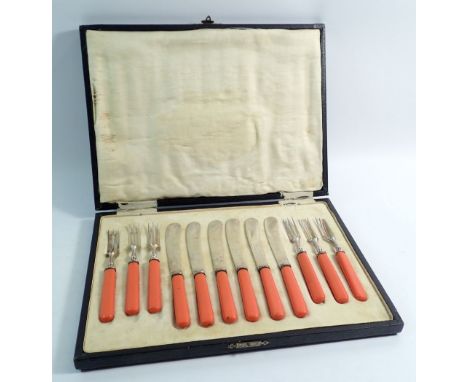 A vintage fruit cutlery set with coral coloured handles - boxed 